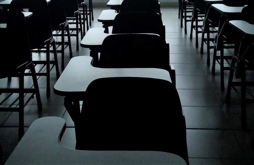 Empty desks depicting school during COVID