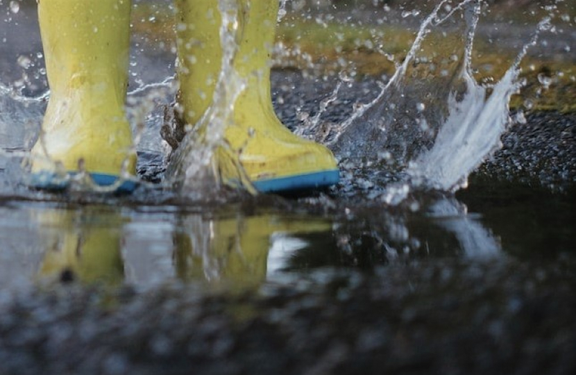 Childhood innocence splashing in boots