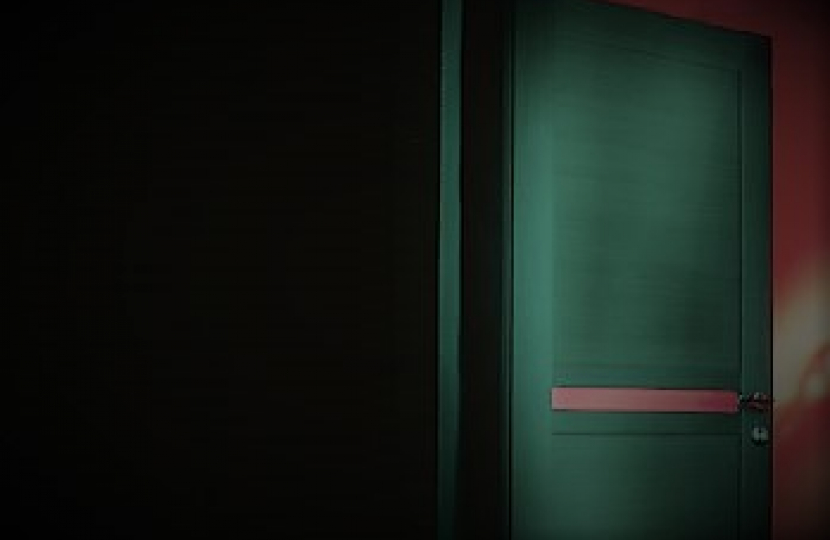 A closed door depicting hidden online danger