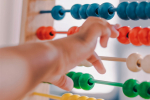 An abacus and baby indicating the importance of family tax policy